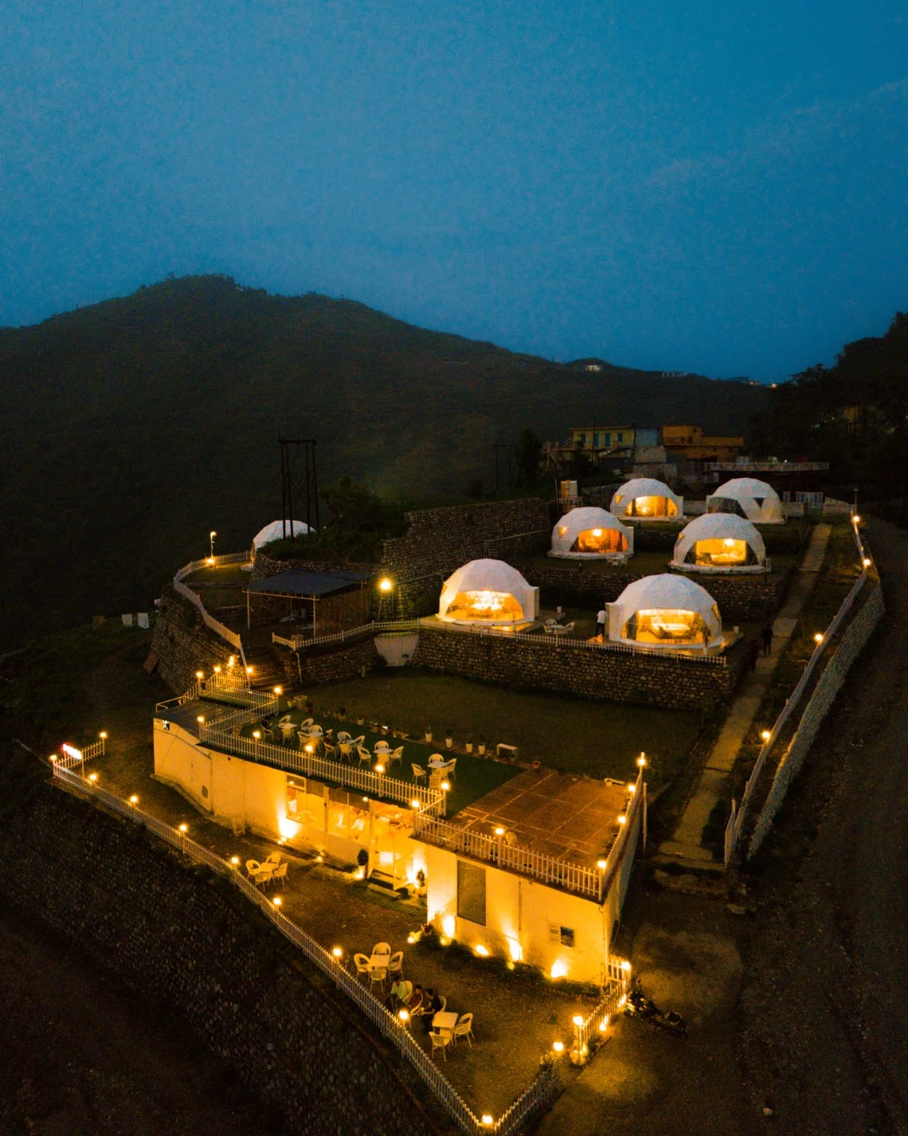 Amantra Hills Resorts and its illuminated domes at dusk